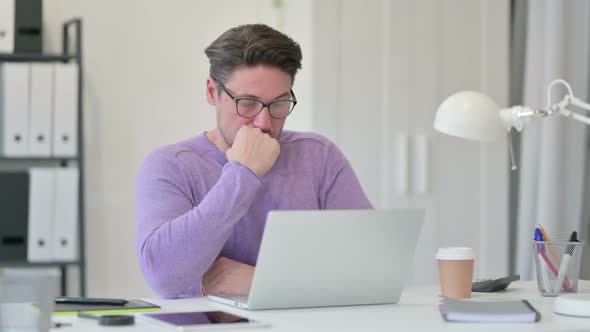 Middle Aged Man Taking Nap in Office