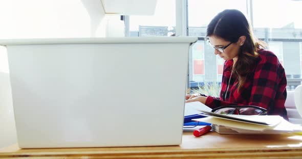 Female executive working at desk