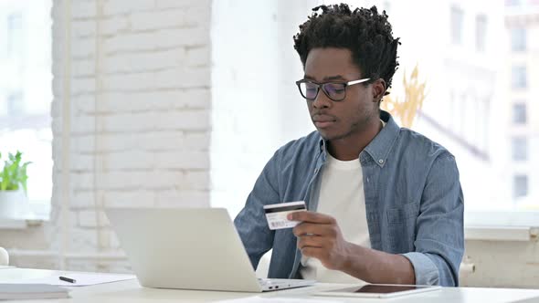 Online Shopping Failure for Young African Man on Laptop