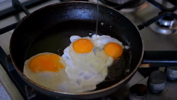 Fried Three Eggs Fried in a Pan. Slow Motion