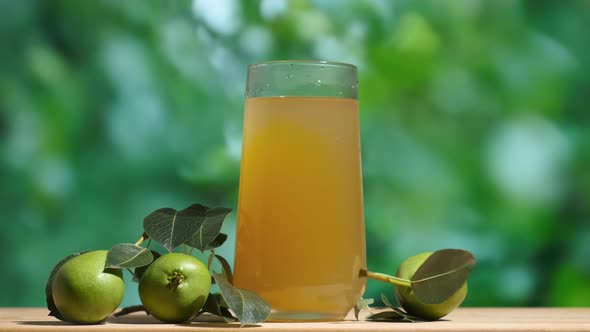 Glass of Pear Juice Outdoors