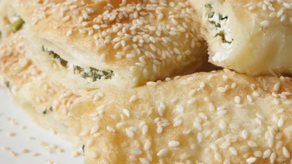 Tilting on dough sheets rolls baked with cheese and spinach filling 4K 2160p 30fps UHD footage - Ser