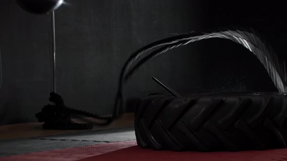 Fit Young Man Training His Hands Using Heavy Ropes