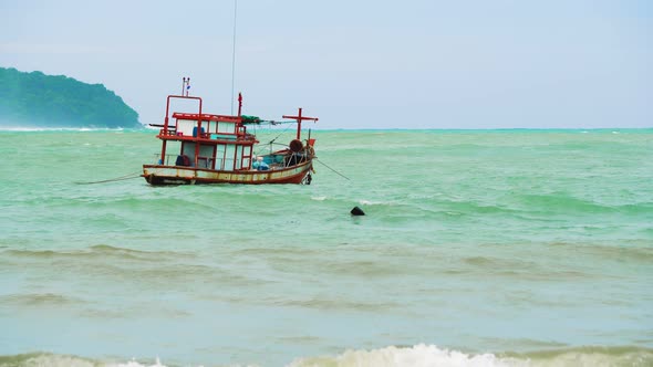 Boat at Sea on The Waves