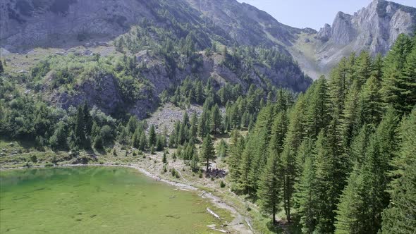 Aerial Zoom Out of Rugove Lake and Mountains in the Albanian Alps