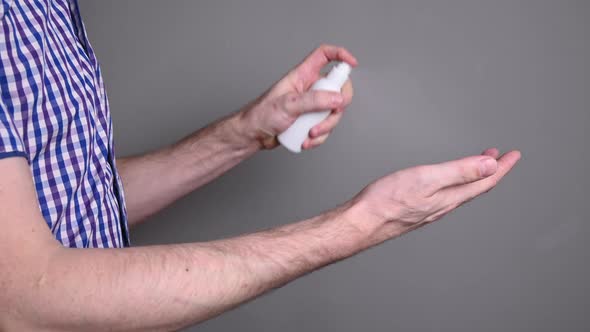 the person handles hands with a sanitizer. prevention against viruses, diseases and epidemics covid