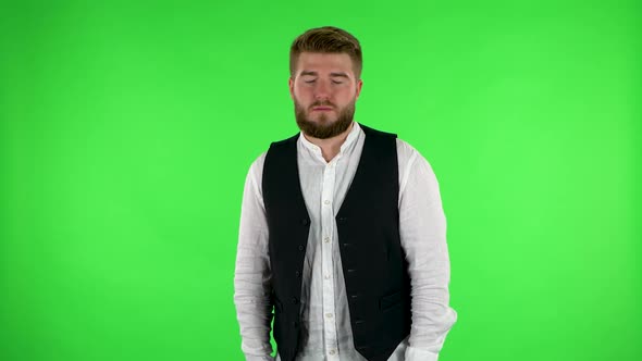 Man Stands Waiting with Boredom. Green Screen