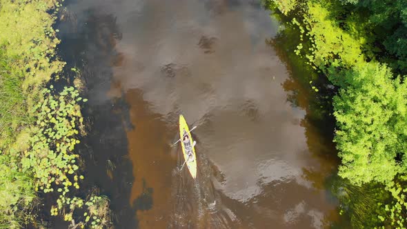 Aerial Drone View of Sport Canoe on Summer Calm Forest River