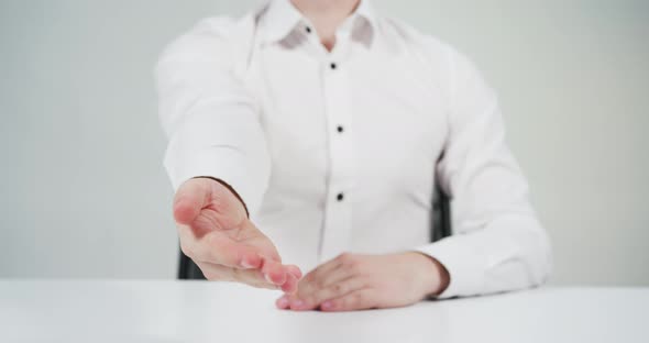 Man giving hand to close a deal