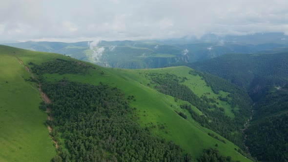 View of the Green Caucasus Mountains in Summer From the Sky