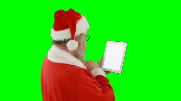 Santa claus using digital tablet