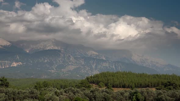 Forested High Mountain Mass Under the Clouds