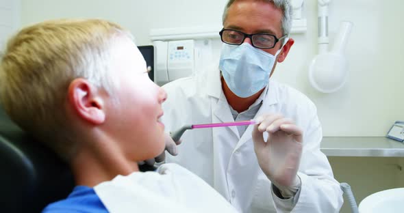 Dentist giving high five to young patient