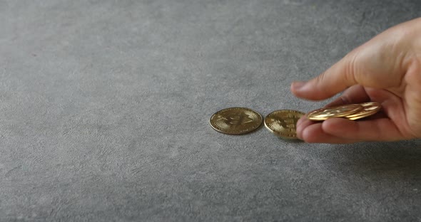 hand showing gold bitcoin. Worldwide cryptocurrency and digital payment concepts.