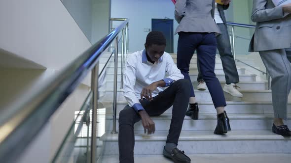 Front View Portrait Angry Overburdened African American Employee Crumpling Documents As Colleagues