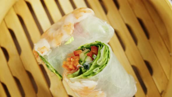 Spring Roll with Chicken or Shrimps in Rice Paper with Sweet and Sour Sauce Closeup Cooking