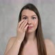 Young Woman Takes Care of Skin of Face - VideoHive Item for Sale
