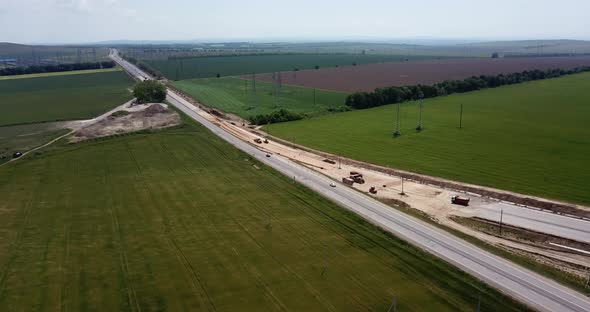 Road Construction Site with Machinery, Bulldozer, Excavation From Above, Video, Aerial View