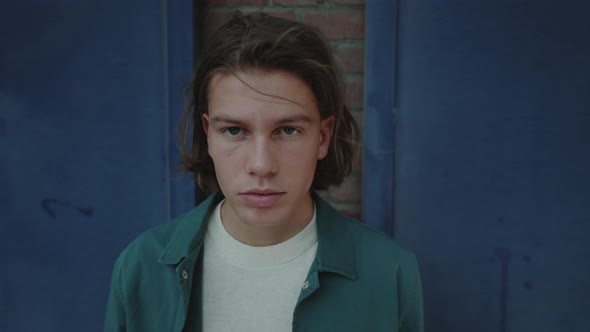 Portrait of Handsome Young Man Posing Outdoors