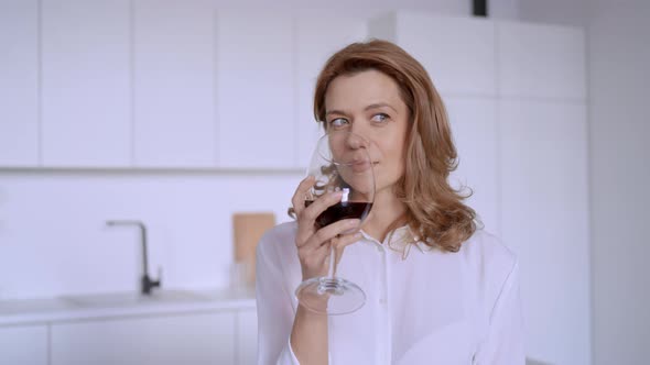 Female Drinking Alcohol in Flat