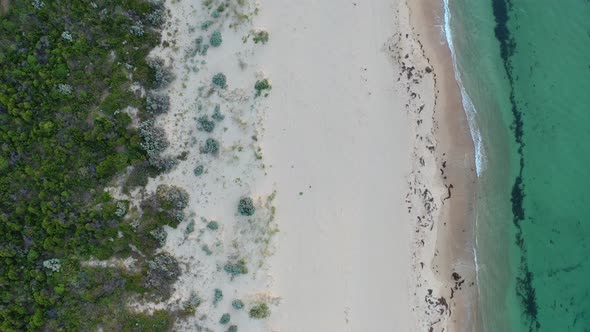 Drone field of view of water meeting beach Mandurah Australia
