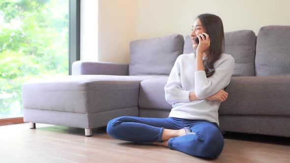 Young asian woman use smart phone