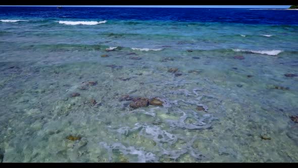 Aerial drone view landscape of tranquil tourist beach journey by blue green lagoon and white sandy b