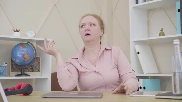 Middle Shot of Senior Caucasian Woman Thinking and Gesturing. Aged Lady Trying To Recall Something