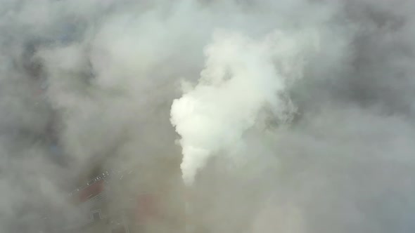 Smoke From a Power Station Chimney Rising From a Low Creeping Fog