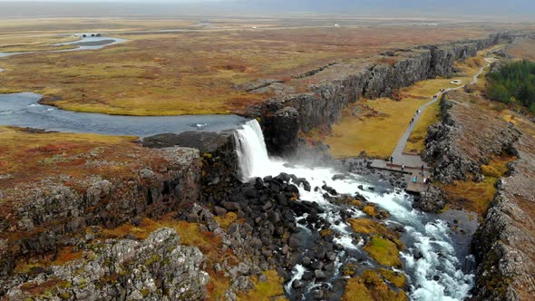 Aerial View Autumn Landscape in Iceland, Rocky Canyon with Waterfall, Thingvellir