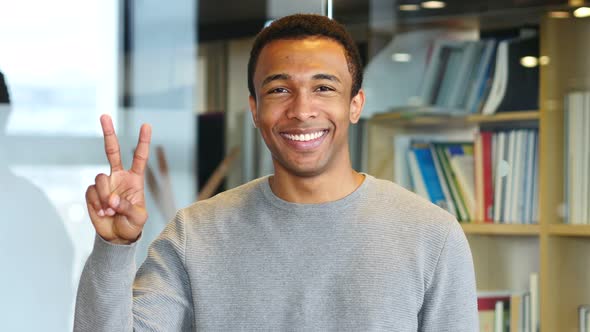 Victory Sign by Young Afro-American Man, Portrait