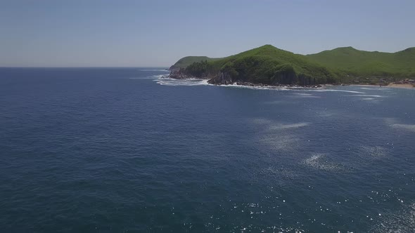 View From a Droneon a Stone Cape Washed By Strong Waves