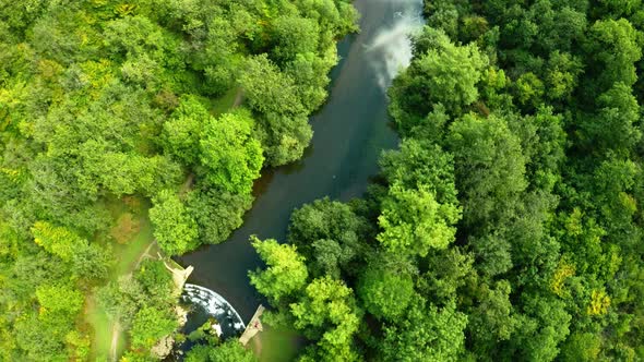 Aerial view of the trees, forests and river in the Derbyshire Peak District National Park near Bakew