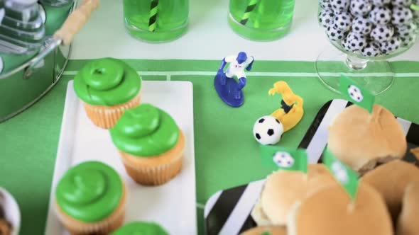 Kids football party set with snacks and drinks.