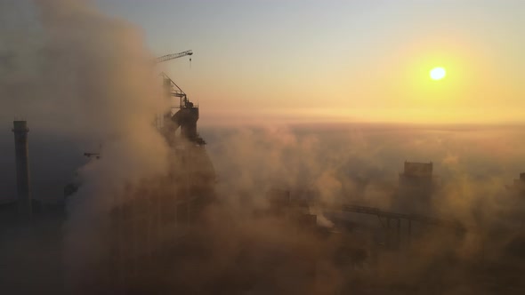 Aerial View of Cement Factory with High Concrete Plant Structure and Tower Crane at Industrial