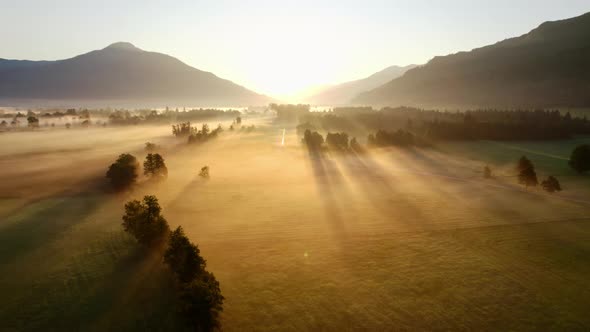 Drone Over Misty Sunlit Landscape Of Zell Am See