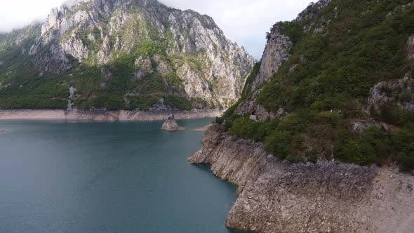 Wide Azure River Flowing Through a Mountain Valley