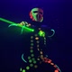 Person in Glowing Suit Dances with Green Beams on Stage - VideoHive Item for Sale