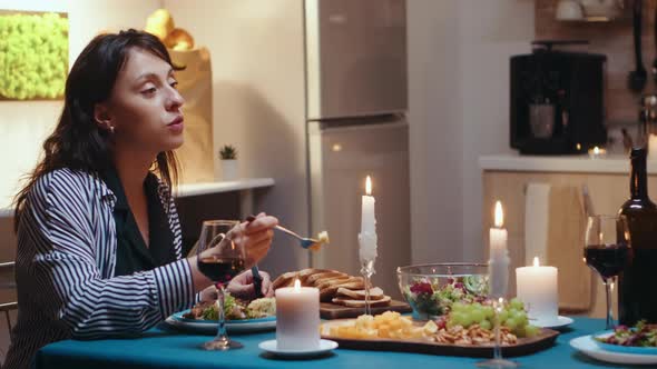 Couple Eating and Drinking Wine