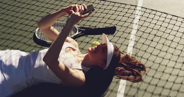 Woman playing tennis on a sunny day