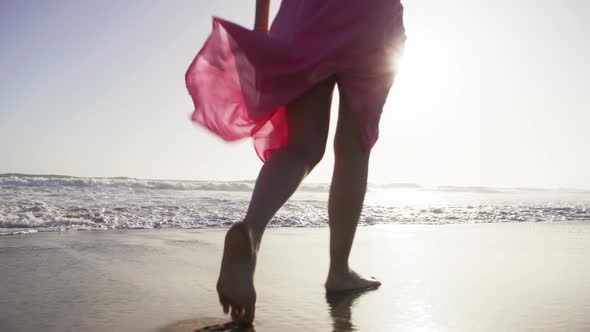 Woman Walks on the Beach at Sunset RED Camera Shooting Woman at Sea Shore 6K