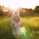 Happy Woman with Daughter in Field - VideoHive Item for Sale