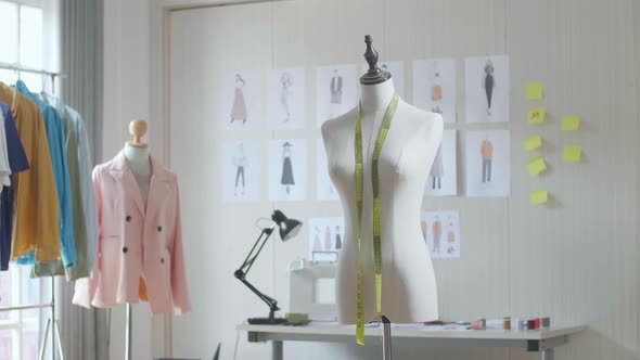 A Mannequin With Tape Measure Is In The Designer Studio