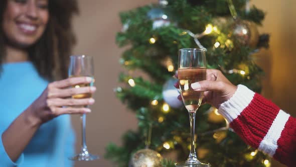 Happy African family toasting with champagne during Christmas holidays