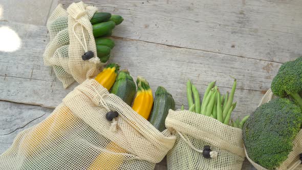 Colorful Vegetables in Reusable Bags on a Wooden Background. Zero Waste. Reduce Plastic Waste