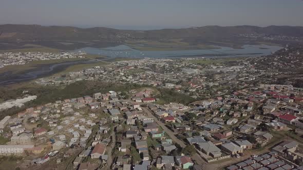 Aerial: Knysna and lagoon far below this hilltop township, South Africa