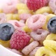 Milk Flow Pouring Into Bowl with Cereal Rings and Berries - VideoHive Item for Sale