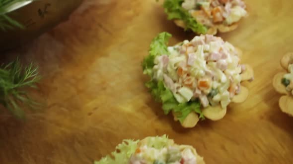 Appetizing Tartlets of Banquet Food with Olivier Salad