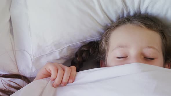 Girl sleeping peacefully with blanket covered on face 4k