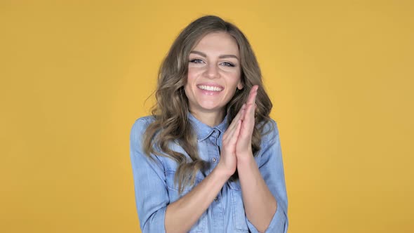 Applauding African Girl, Clapping Isolated on Yellow Background